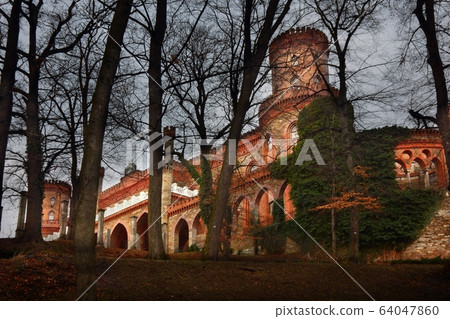 Evening view at chateau Kamieniec Zabkowicki, Poland 64047860