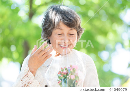 Senior woman walking Senior woman walking 64049079