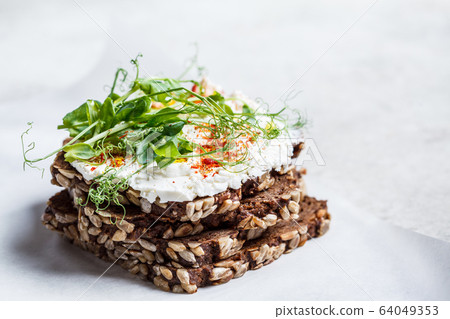 Toast with cream cheese and seedlings. Toast with cream cheese and seedlings. 64049353