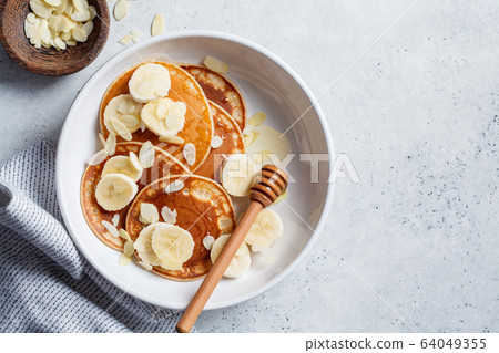 Traditional pancakes with banana, almonds Traditional pancakes with banana, almonds 64049355