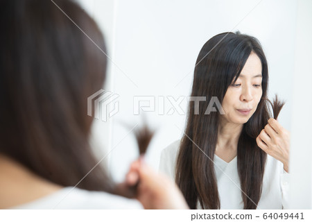 Senior woman with hair problems Senior woman with hair problems 64049441