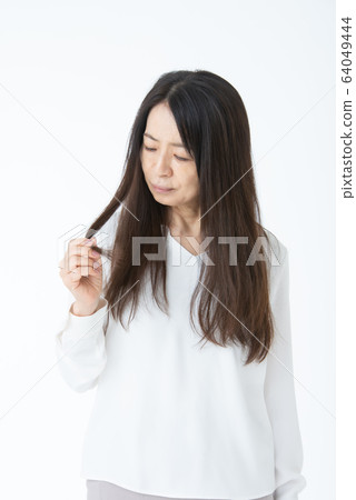 Senior woman with hair problems Senior woman with hair problems 64049444