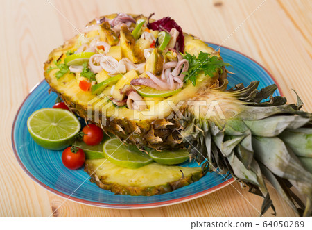Salad of calamari, pineapple and lemon Salad of calamari, pineapple and lemon 64050289