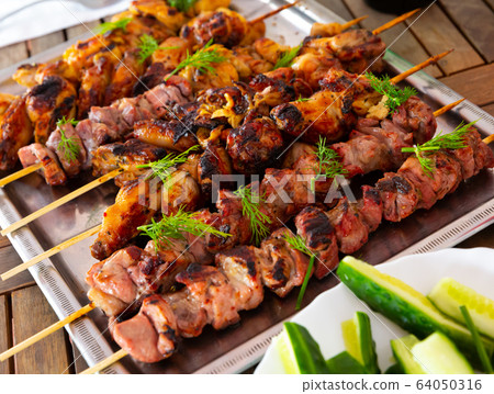 Tasty barbecue pork and chicken closeup 64050316