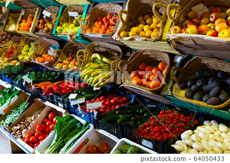 Raw fresh vegetables and fruits assortment on counter 64050433