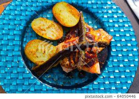 Dish of tasty steak of fried salmon with potatoes and asparagus 64050446