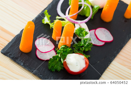Raw vegetables with baby carrots Raw vegetables with baby carrots 64050452