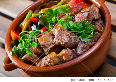 Tasty dish ghiveci of bulgarian cuisine of beef with paprika at clay pot 64050688