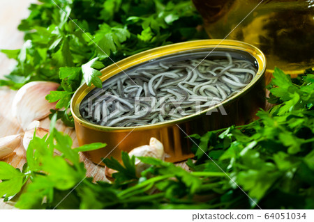 Pickled angoulas in tin can. Spanish cuisine 64051034