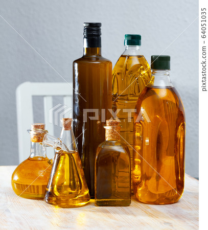 Vegetable oil on wooden table 64051035