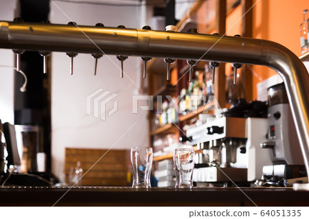 Image of modern beer bar with metal beer taps Image of modern beer bar with metal beer taps 64051335