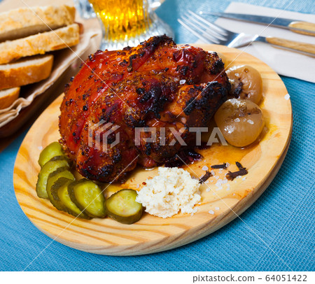 Roast pork knuckle with vegetables 64051422
