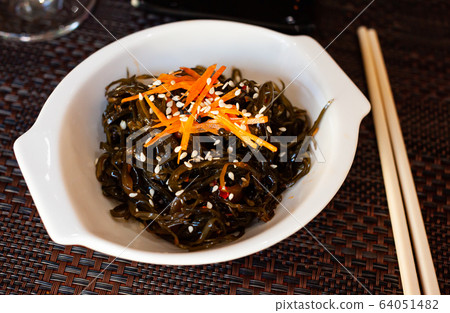 Appetizing seaweed salad. Japanese cuisine Appetizing seaweed salad. Japanese cuisine 64051482
