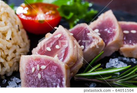 Tuna Tataki garnished with rice Tuna Tataki garnished with rice 64051504