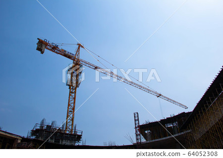 Yellow construction tower crane Yellow construction tower crane 64052308