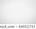 White brick wall texture background in room at 64052733