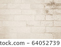 Background of wide cream brick wall texture. Old 64052739