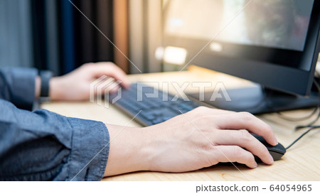 Holding computer mouse while using computer 64054965