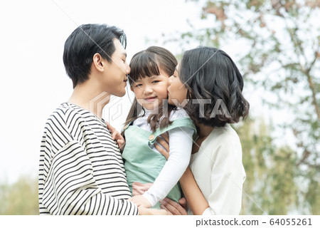 Portrait of parent and child playing outdoors 64055261