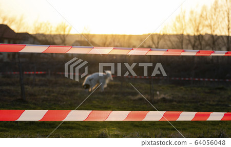 quarantine tape on field stay at home coronavirus quarantine tape on field stay at home coronavirus 64056048