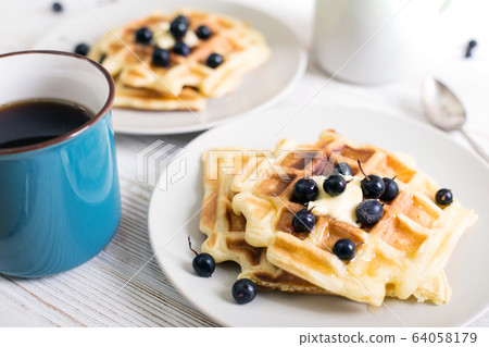 Belgian waffles and tea Belgian waffles and tea 64058179