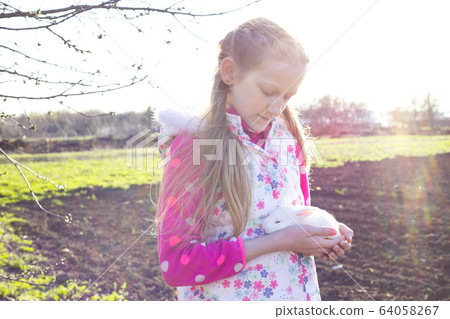 girl and rabbit 64058267