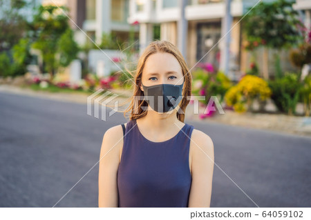Fashionable black medical mask with filter in the city. Coronavirus 2019-ncov epidemic concept 64059102