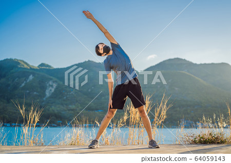 Runner wearing medical mask, Coronavirus pandemic Covid-19. Sport, Active life in quarantine 64059143