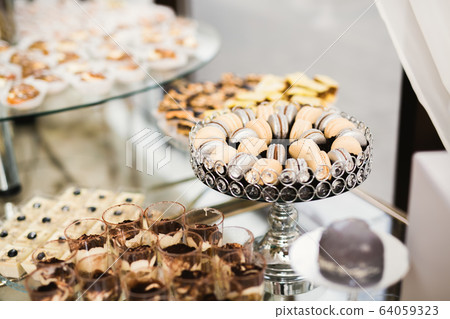 Delicious wedding reception candy bar dessert table 64059323