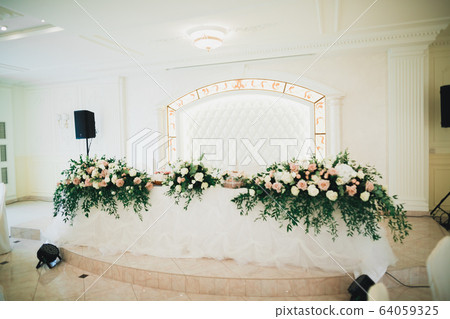Interior of a restaurant prepared for wedding ceremony Interior of a restaurant prepared for wedding ceremony 64059325