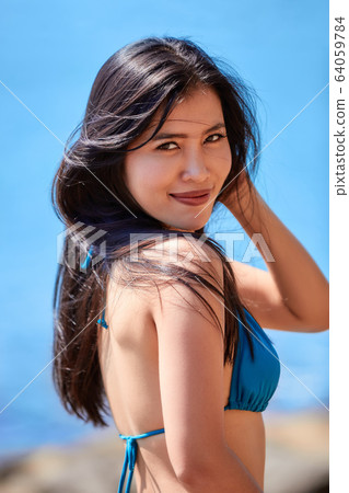 Close-Up portrait of beautiful asian girl in a 64059784