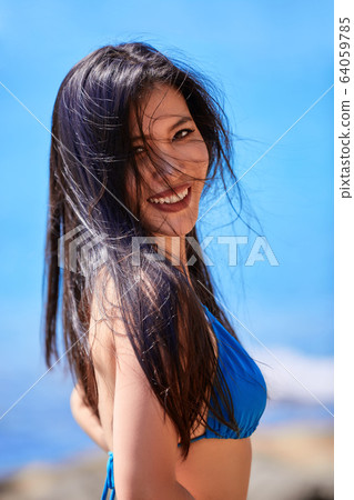Close-Up portrait of beautiful asian girl in a 64059785