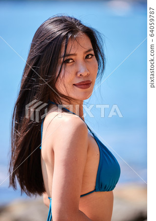 Close-Up portrait of beautiful asian girl in a 64059787