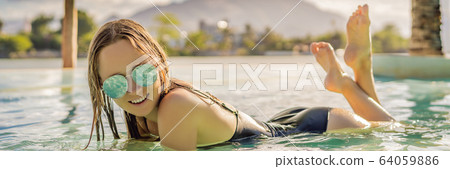 Luxury resort swimming pool. Beautiful woman tourist relaxing in holiday retreat on summer travel 64059886