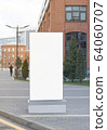 Blank white vertical pylon stand mock up brick building background 64060707
