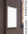 Blank white glass rectangular poster mockup brick wall mounted 64060708