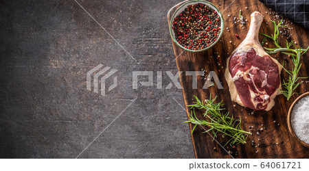 Top view of duck leg preparaton in a dark rustic Top view of duck leg preparaton in a dark rustic 64061721