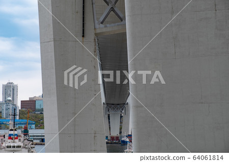 Vladivostok, Russia - May 07, 2019: The bridge over the Amur Bay and the Golden Gate. Vladivostok, Russia - May 07, 2019: The bridge over the Amur Bay and the Golden Gate. 64061814