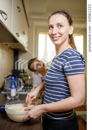 Mom and her son have fun in kitchen on quarantine 64062323