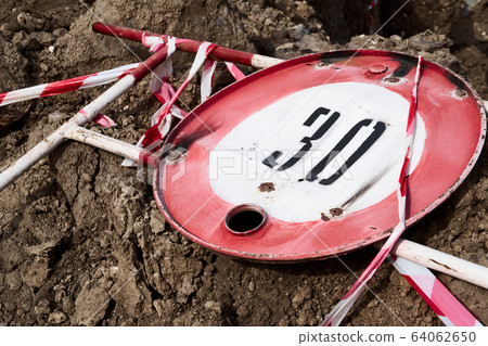 the road sign for the speed limit of thirty 64062650