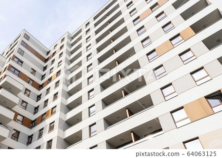 Modern new home with beautiful facade painting, exterior shot. Europe 64063125