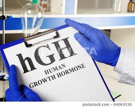 Doctor shows hGH Human growth hormone sign. Doctor shows hGH Human growth hormone sign. 64063530