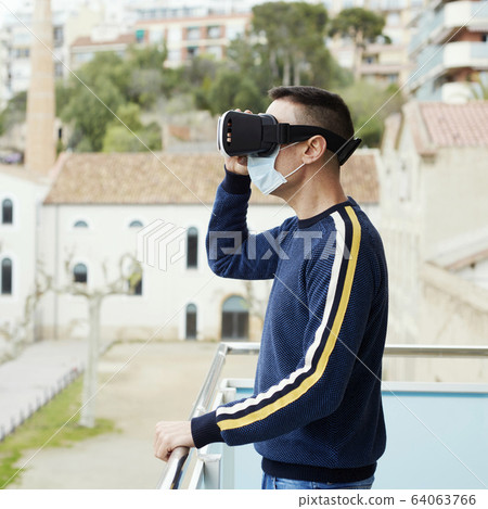 man using a virtual reality headset 64063766