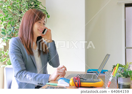 Engineer calling with a smile Engineer calling with a smile 64064159