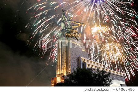 Soviet monument Rabochiy i Kolkhoznitsa ( Worker and Kolkhoz Woman) of sculptor Vera Mukhina (made of in 1937)  and fireworks in honor of Victory Day celebration (WWII), Moscow, Russia 64065496