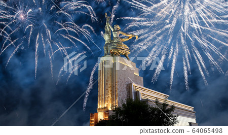Soviet monument Rabochiy i Kolkhoznitsa ( Worker and Kolkhoz Woman) of sculptor Vera Mukhina (made of in 1937)  and fireworks in honor of Victory Day celebration (WWII), Moscow, Russia 64065498