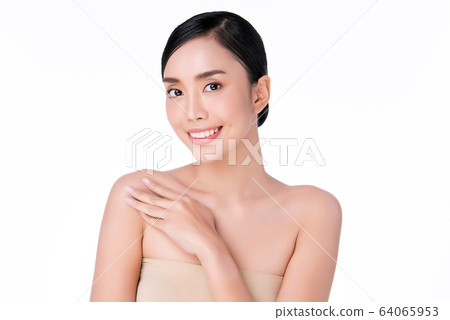 Beautiful Young Asian Woman with Clean Fresh Skin. Face care, Facial treatment, Cosmetology, beauty Beautiful Young Asian Woman with Clean Fresh Skin. Face care, Facial treatment, Cosmetology, beauty 64065953