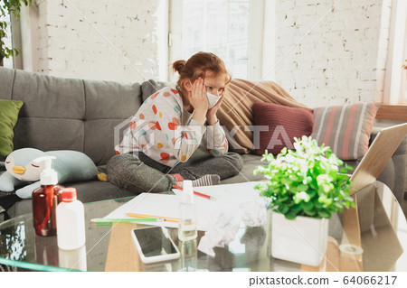 Little girl in protective mask isolated at home with coronavirus symptoms, stop epidemic Little girl in protective mask isolated at home with coronavirus symptoms, stop epidemic 64066217