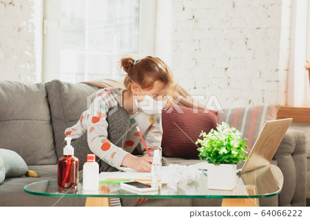 Little girl in protective mask isolated at home with coronavirus symptoms, stop epidemic Little girl in protective mask isolated at home with coronavirus symptoms, stop epidemic 64066222