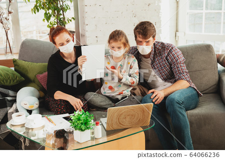 Caucasian family in protective masks and gloves isolated at home with coronavirus symptoms, treatment 64066236